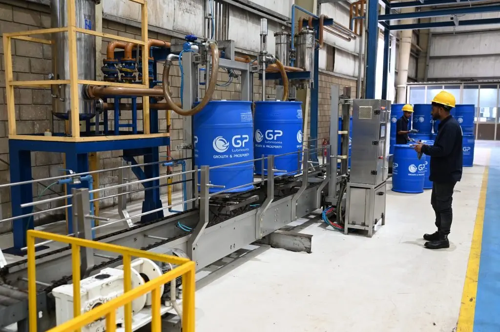 Operator at a drum filling station with GP drums in the GP Pakistan plant